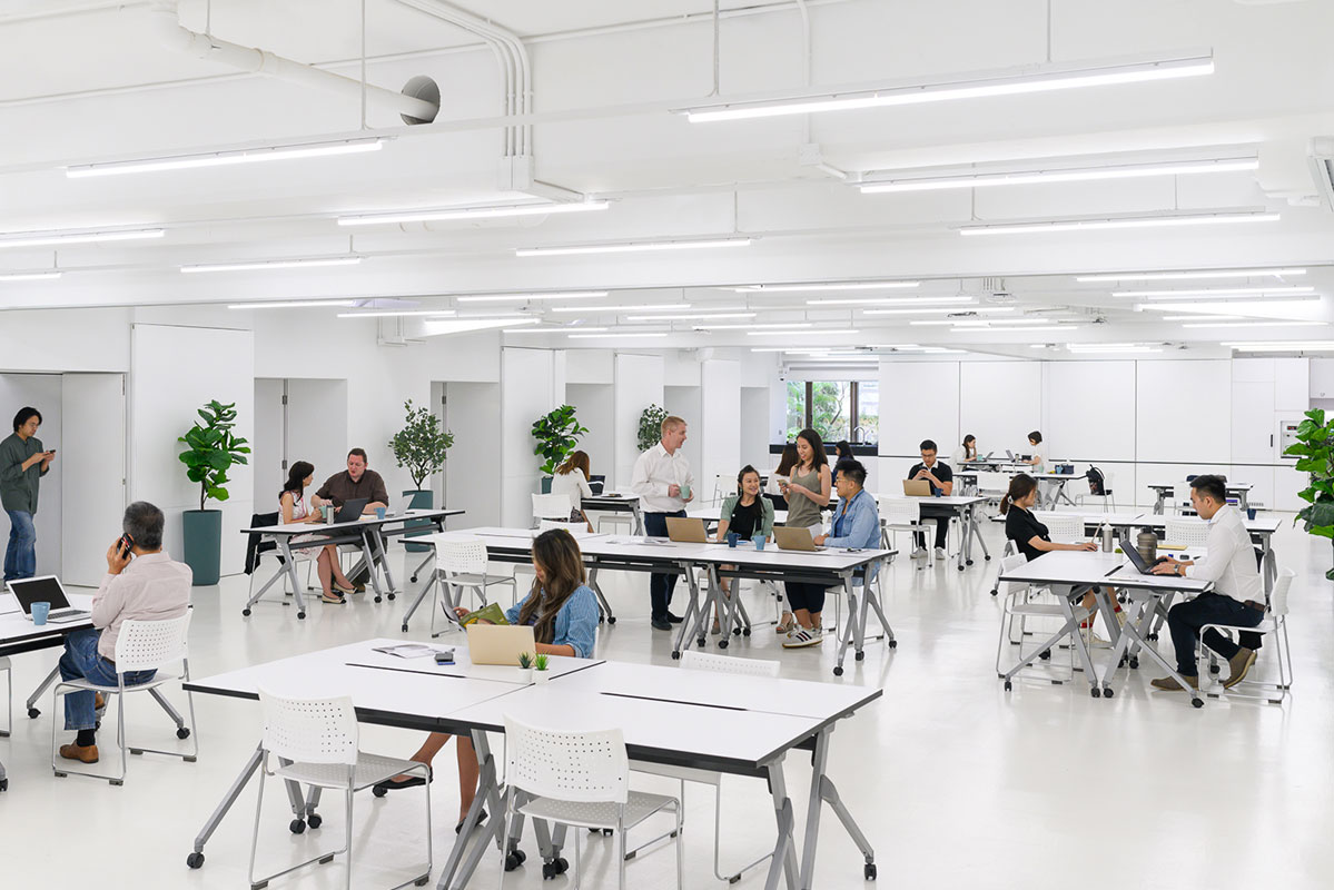 A White Sleek And Modern Co Working Space At The Desk